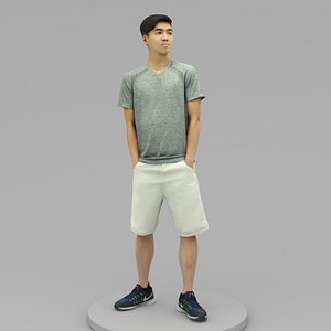 A Young Man Posing with Hands in Pockets