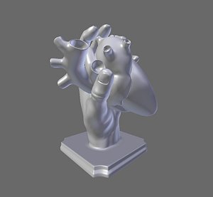hand holding heart statue
