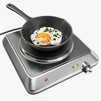 Iron skillet with egg on a single hotplate hob
