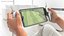 Tablet Gaming Console with Controllers in Hands