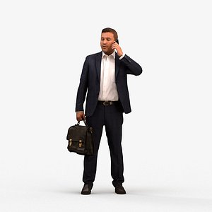 00573Omar005 - Adult Middle Eastern man making phone call in business office setting