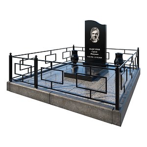 Grave with black polished tombstone and railing