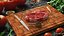 Ribeye Steak with Green Peppercorns on Cutting Board