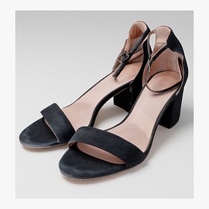 Pair of black womans heeled sandals sandal on heel