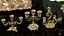 Conjunto de 133 modelos de castiçais, velas ornamentadas e esculturas de cera.