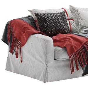 White Sofa with Quilted Cushions and Red Throws
