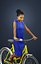 May An Elegant Black African Lady Dressed In A Blue Dress While Riding Her Yellow Bicycle