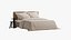Beige bed with seersucker fabric bedding