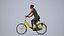 00286Masha001 - Adult Caucasian woman cycling through public space in casual summer attire
