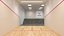 Escena interior de la cancha de squash