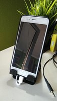 Universal phone holder with rear USB storage