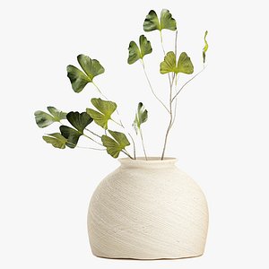 A bouquet of branches with Ginkgo leaves in a modern ceramic vase