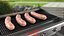 Raw Pork Sausages on Gas Grill Setup