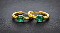 Elegant hoop earrings with an English clasp and a closed stone setting