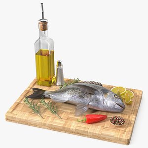 Cooking Set for Gilthead Seabream with Lemon and Herbs on Cutting Board