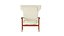 Sillón grande de estilo Mid Century con respaldo alto, diseñado por Ib Kofod-Larsen, Dinamarca, 1950.