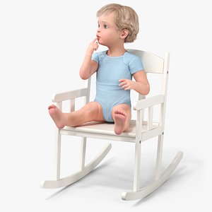 Boy Sitting in a Rocking Chair