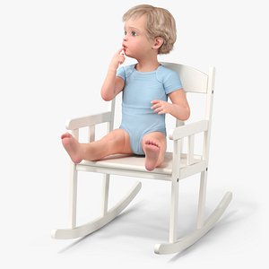 Boy Sitting in a Rocking Chair