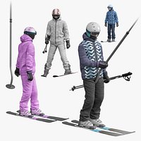 Skiers on platter drag lift