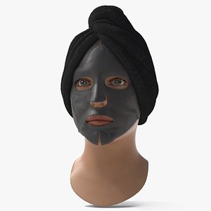 Black Facial Sheet Mask on Face with Towel Fur
